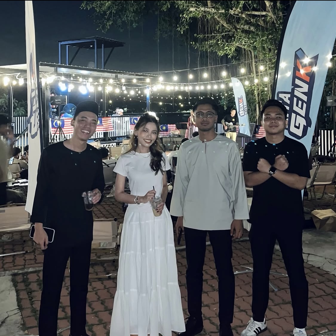 Bella with collaborators at an evening community event